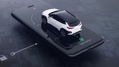 Modellauto steht auf einem Smartphone