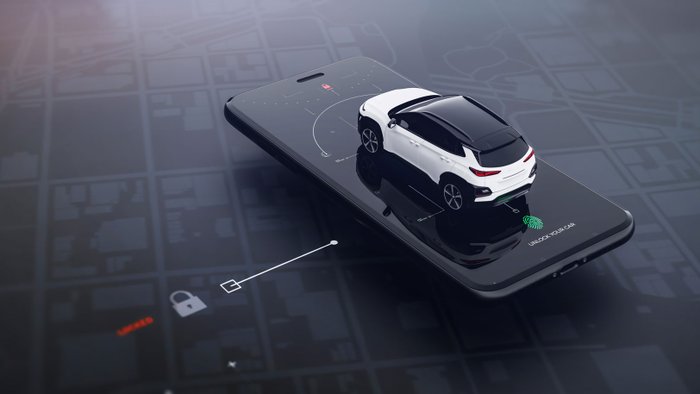 Modellauto steht auf einem Smartphone