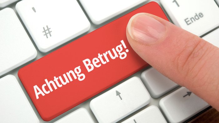 Das Wort Betrug steht auf einer Computer-Tastatur